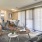 a living room with a couch and chairs